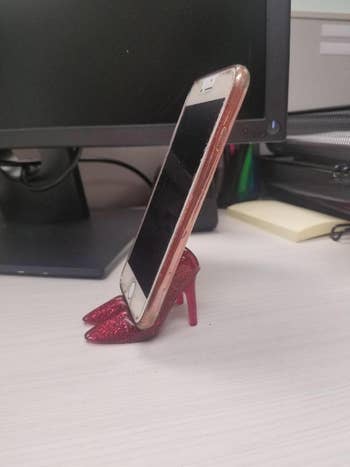 reviewer image of the red shoe-shaped phone holder