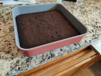 reviewer image of uncut brownies in a perracotta colored pan