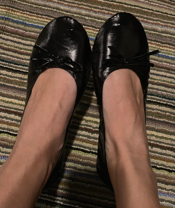 reviewer's feet in the round toe flats
