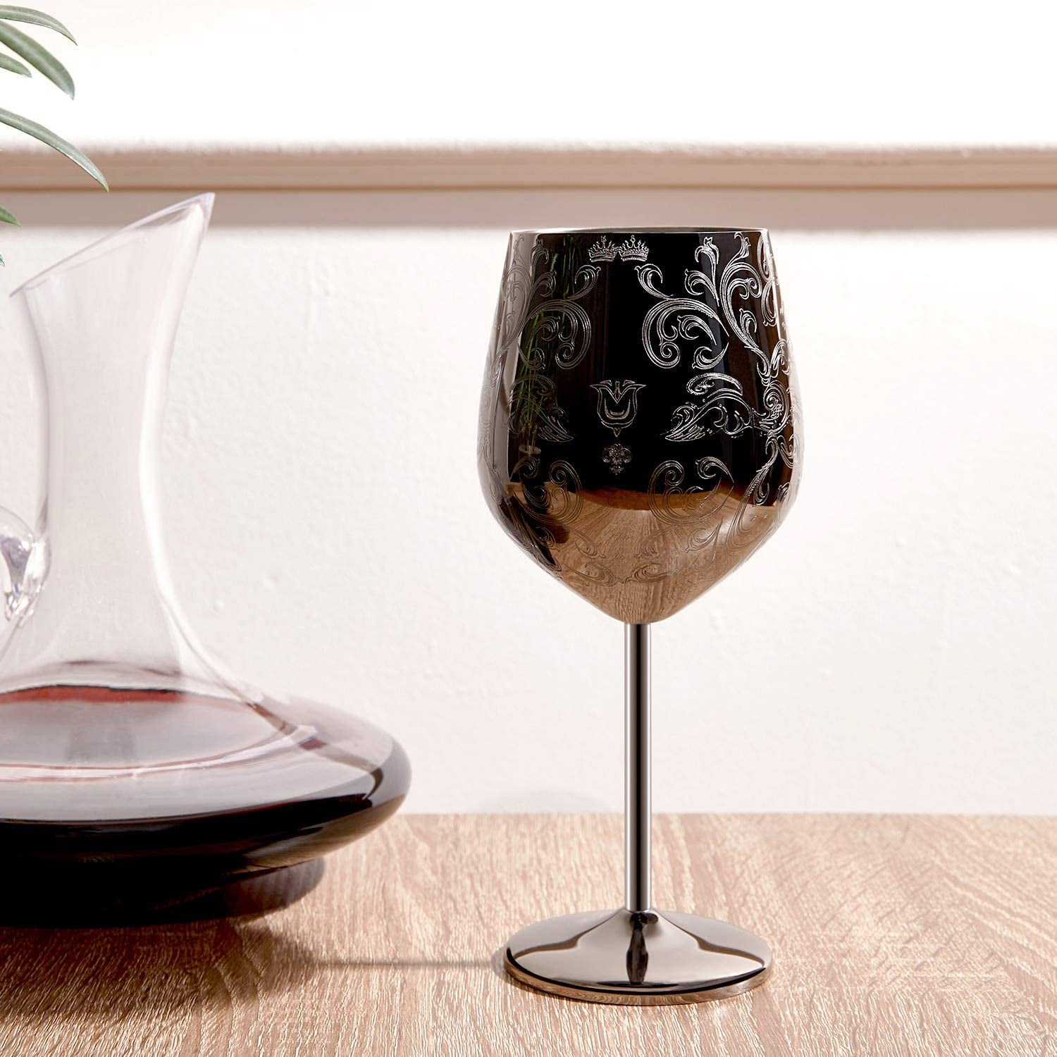 wine glass with etched design on it