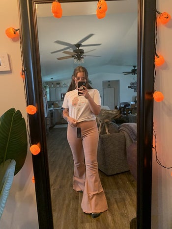 reviewer mirror selfie wearing pink bellbottom jeans