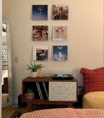 Reviewer's workspace decorated with six vinyls on the wall