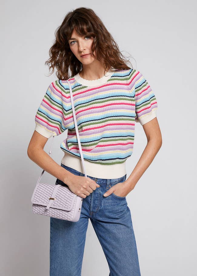 model wearing the colorful printed scallop neck knit top
