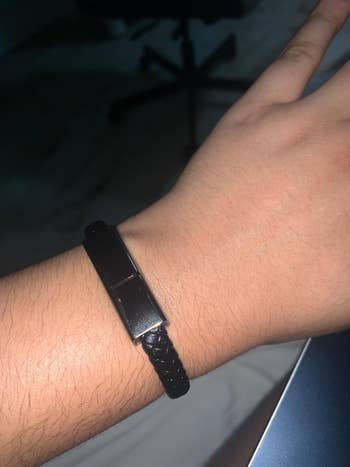reviewer wears black USB cord bracelet around wrist