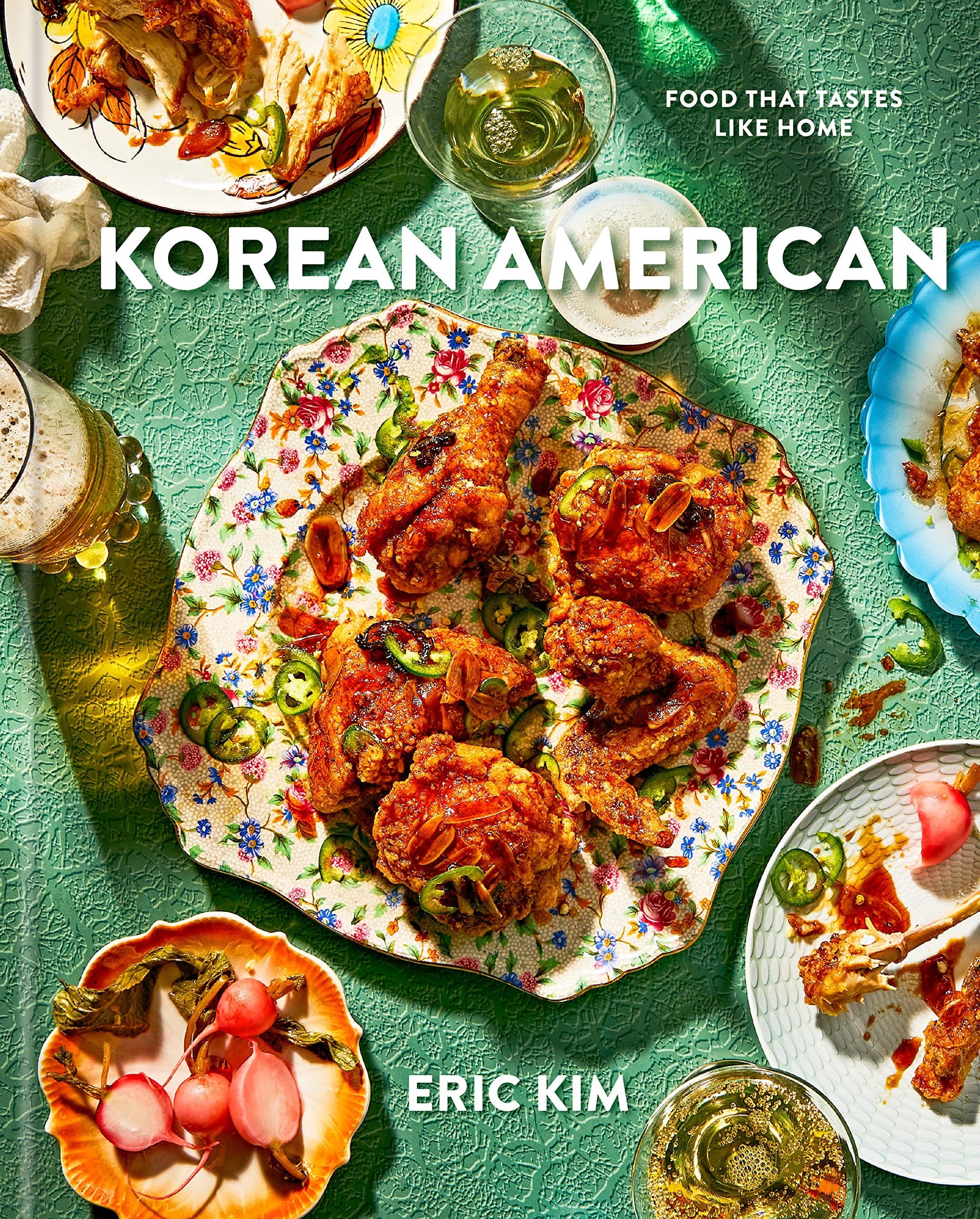 the green Korean American cookbook cover featuring a plate filled with chicken