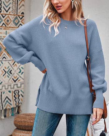 model wearing gray-blue sweater