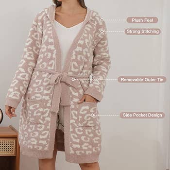 Model in a beige and white cheetah print tie-waist hooded robe