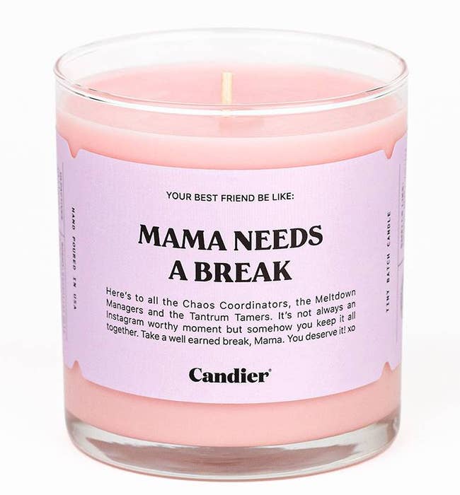 a pink candle with a label that says, 