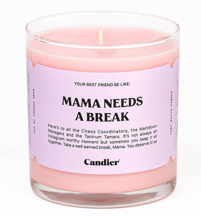 a pink candle with a label that says, 
