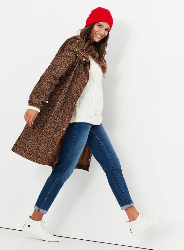 model wearing a leopard-print raincoat