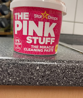 Reviewer image of pink and white container that reads 