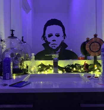 the michael myers decal on a bathroom mirror