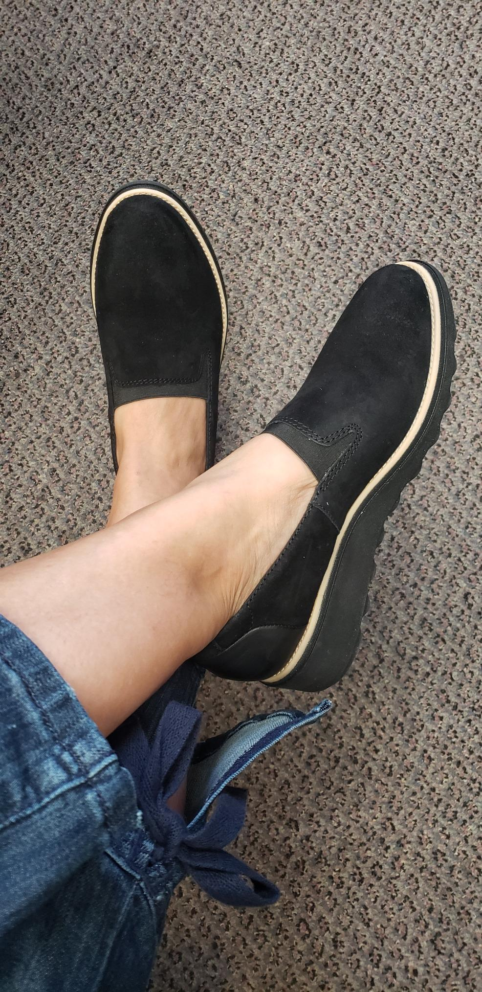 reviewer wearing the achromatic  loafers
