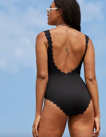another model in black showing the back view