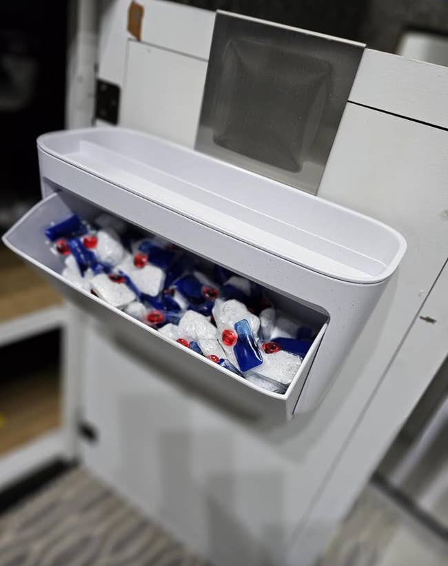 Drawer open on a freezer with packaged ice packs inside
