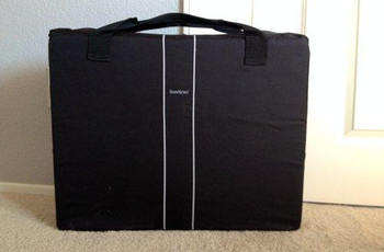The crib folded up into a carrying case