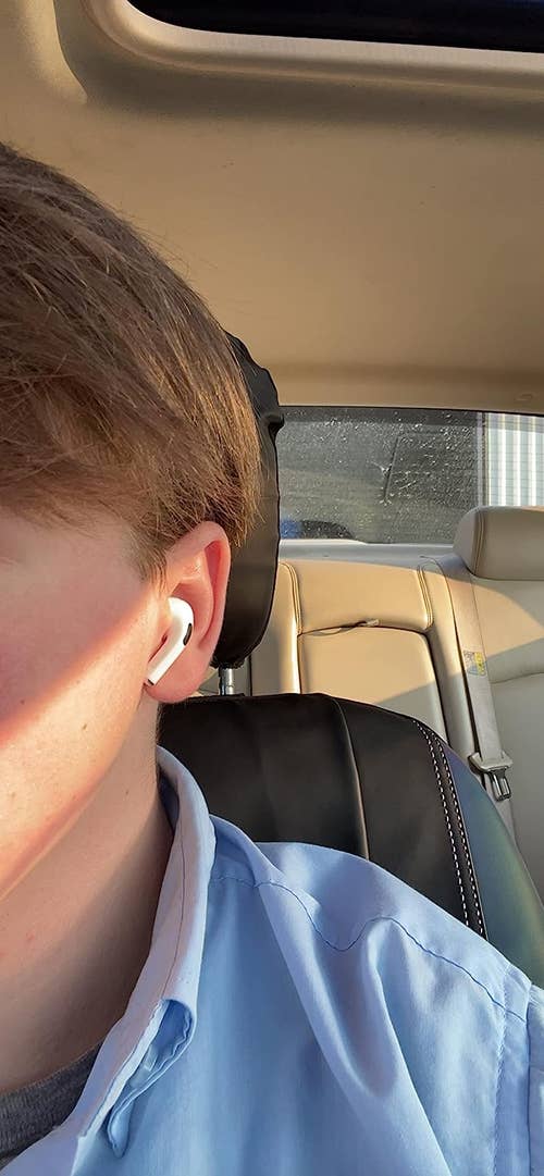 reviewer's ear with AirPod in it