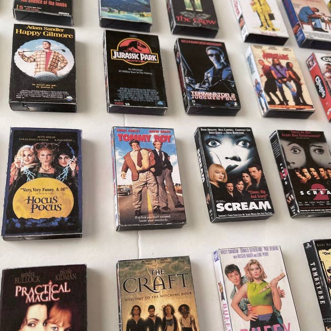 Assorted classical  VHS movie   covers are dispersed  out, including 