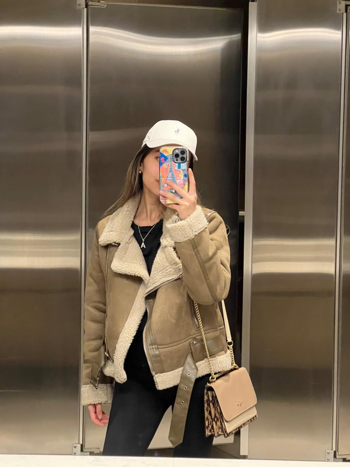 reviewer wearing the fleece lined overgarment   successful  tan