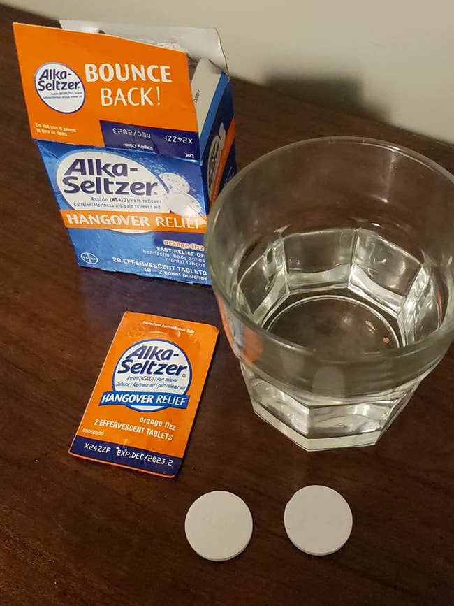 reviewer image of two alka-seltzer tablets next to a glass of water