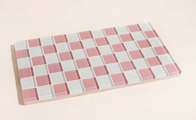 a pink and white checkered glass tile tray