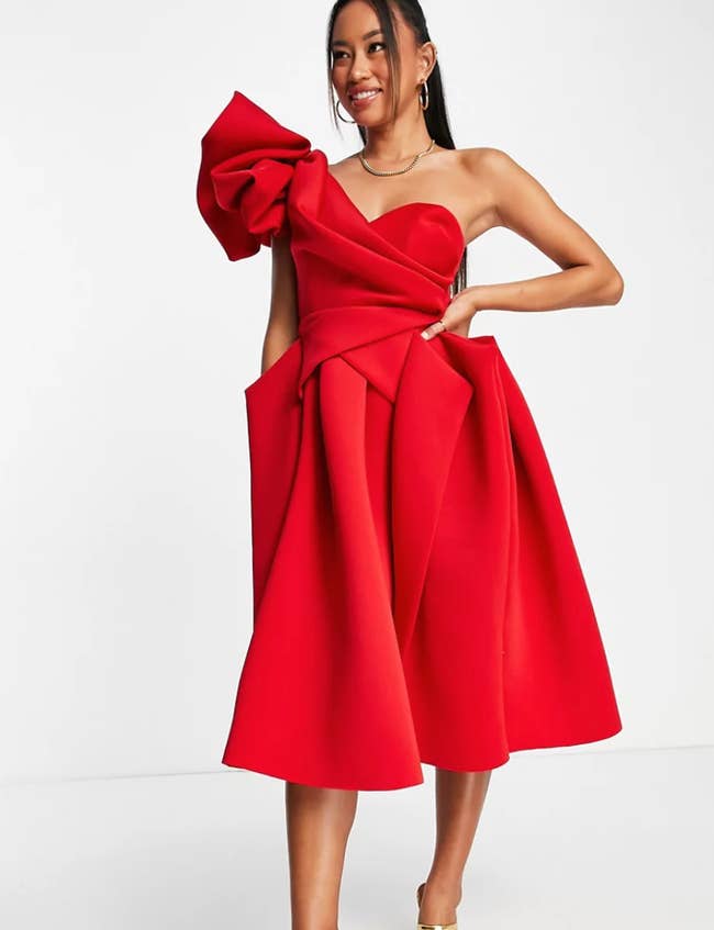 A model wearing the dress in red
