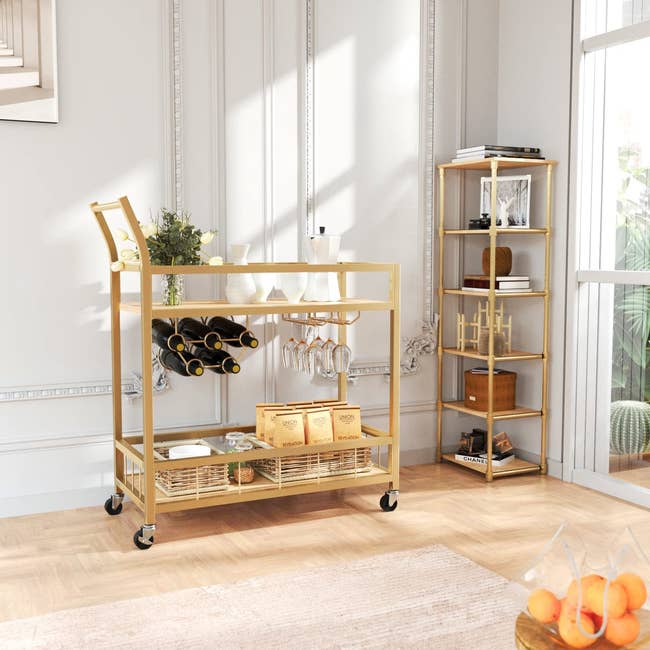 a bar cart that is storing refreshments and drinkware