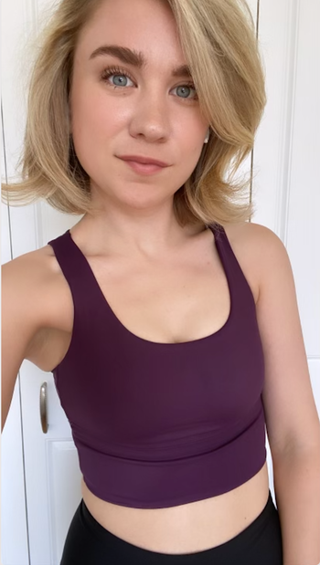 Buzzfeed editor in a purple crop top bra 