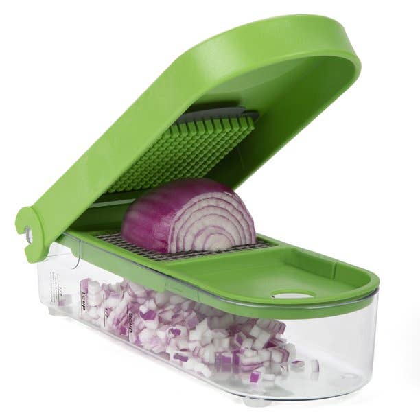 A green chopping gadget with a red onion