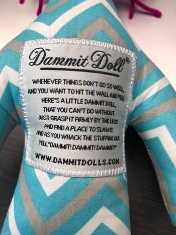 zoomed in view of the doll's patch which explains how to use it