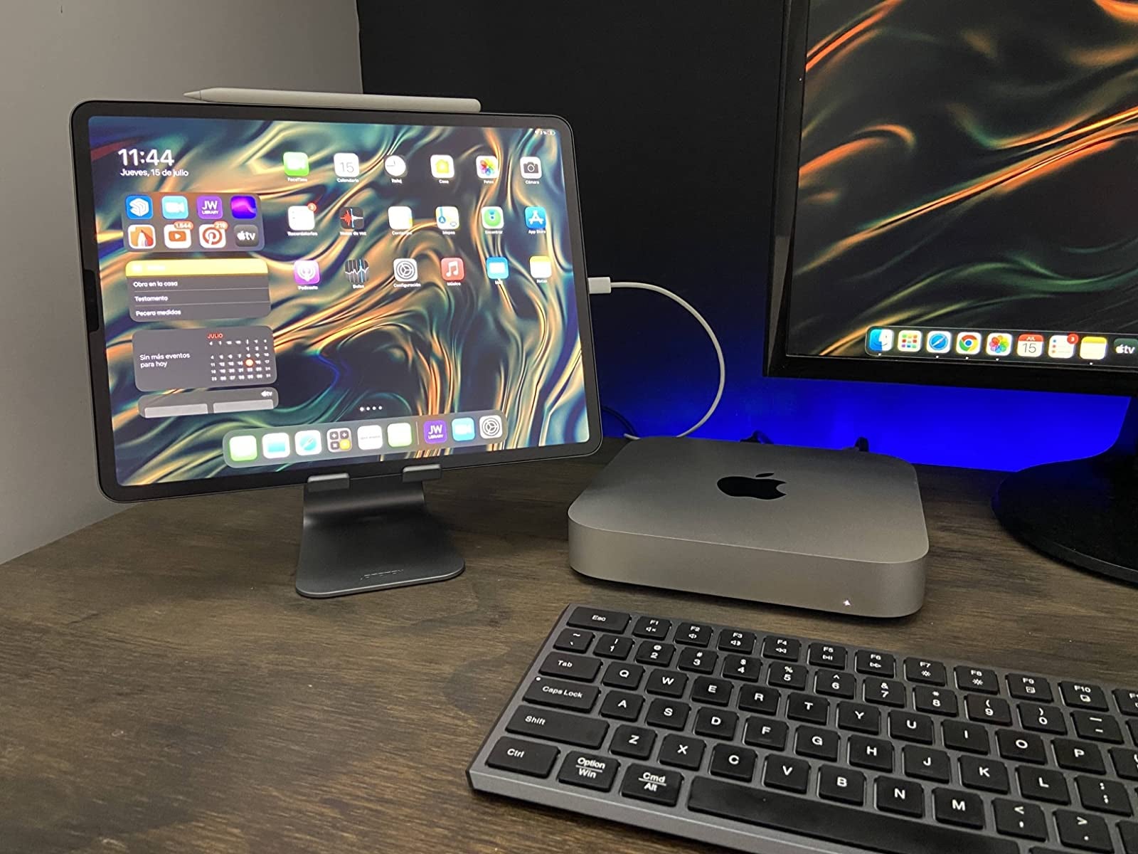 reviewer's tablet on a gray stand next to monitor