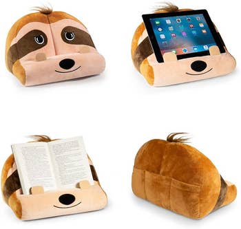 a sloth lap cushion holding a tablet and a book