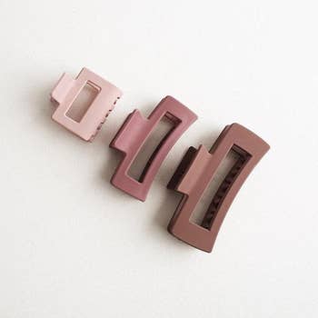 product image of three dusty pink / mauve claw clips of increasing size