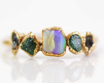 Image of purple, gold, and green gemstone ring