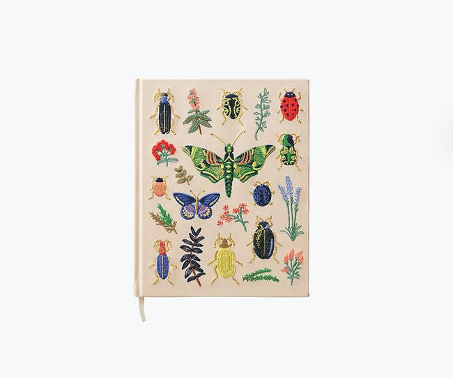embroidered bugs on notebook