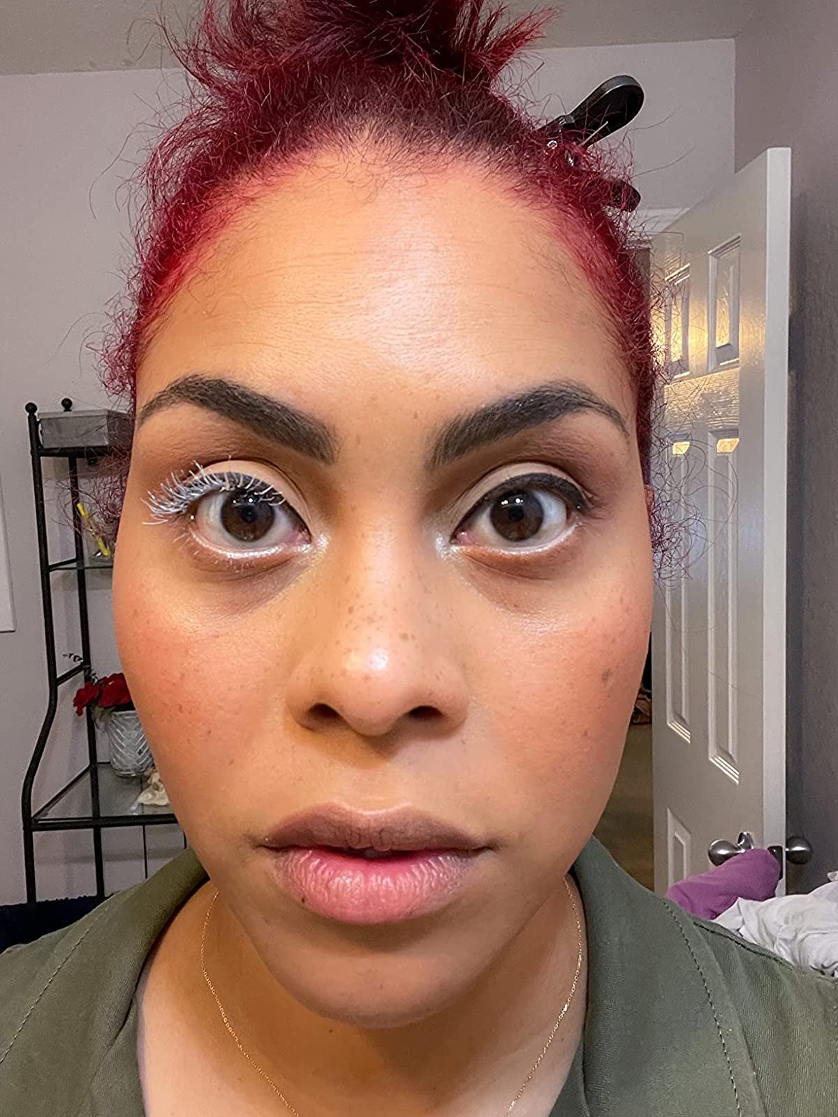 reviewer with the white lash primer on one eye