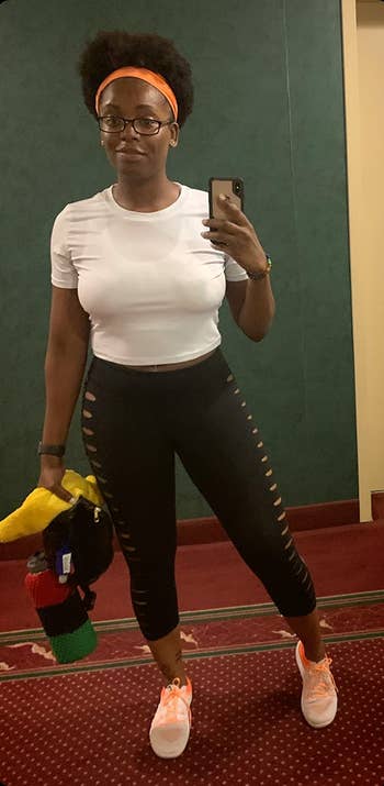 reviewer gym mirror selfie wearing white t-shirt