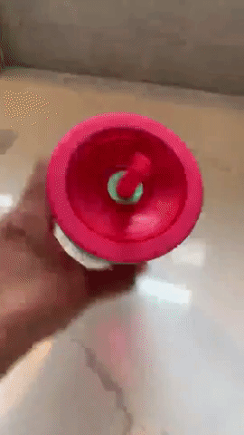 gif of another reviewer turning the full cup upside down and shaking it with no spills
