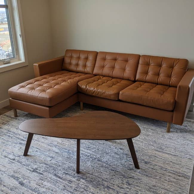 walnut coffee table in a reviewer's living room