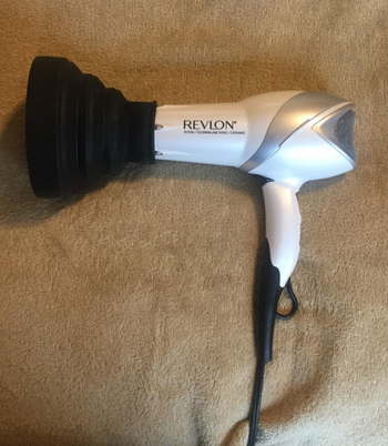 reviewer photo of the diffuser attached to a hairdryer