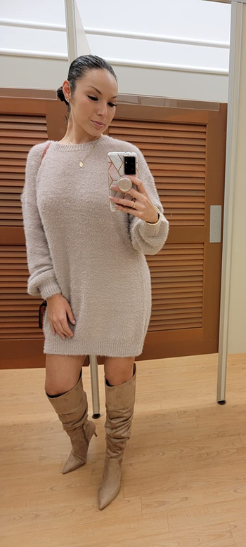 reviewer mirror selfie wearing the dress in oatmeal color