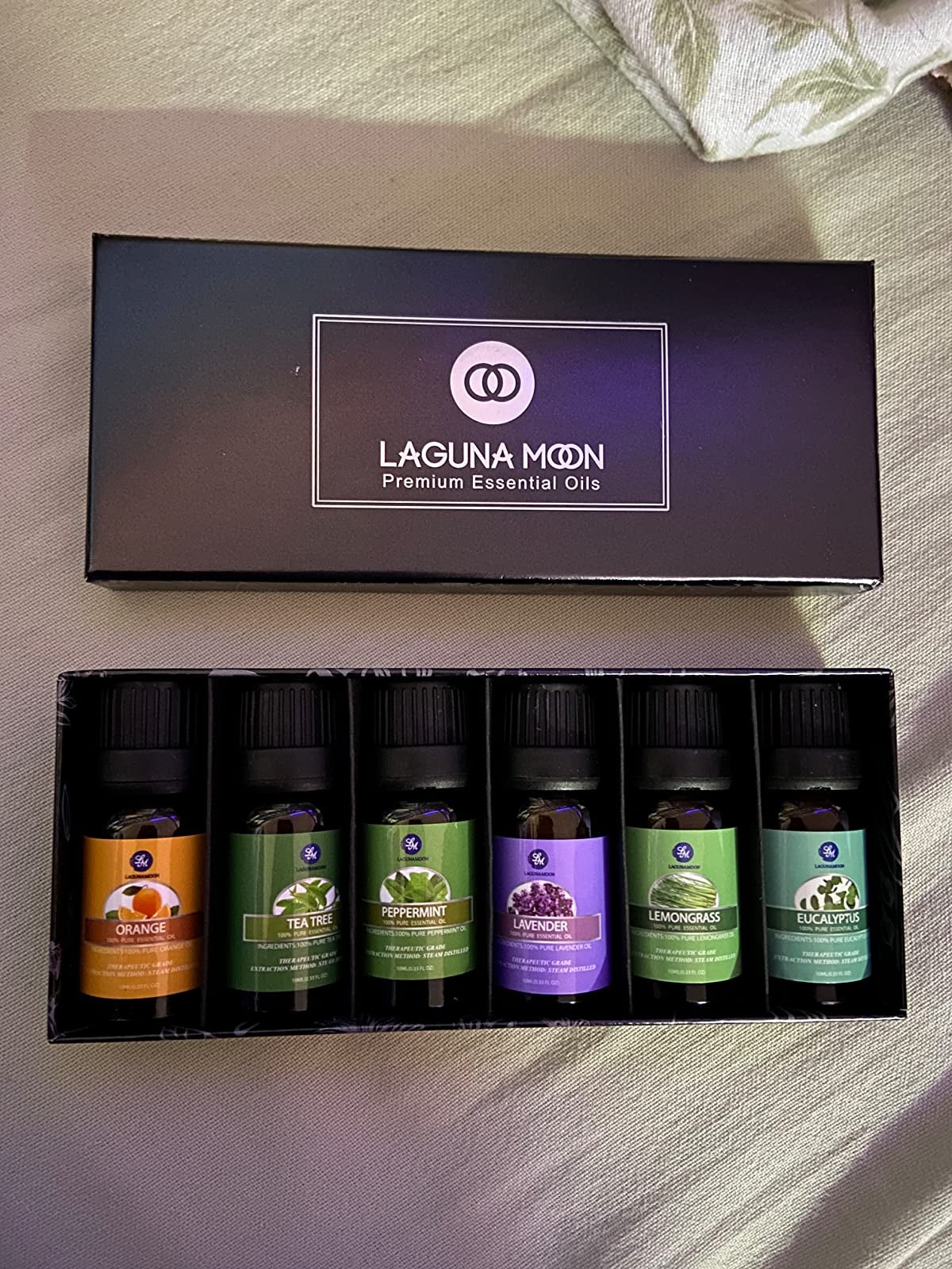 Reviewer's box of the six oils laying on a table