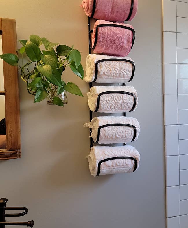 reviewer's towel rack holding six towels