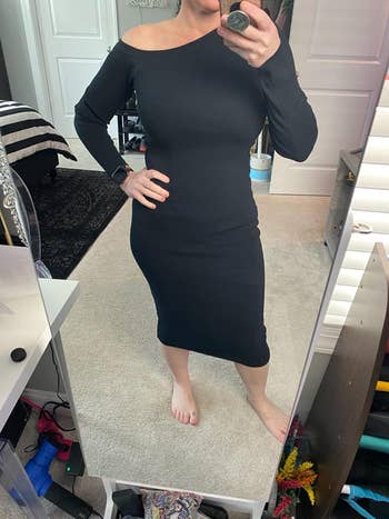 reviewer mirror selfie wearing the dress in black