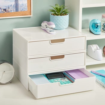 three tiers of the stackable plastic drawers, with bottom drawer pulled out