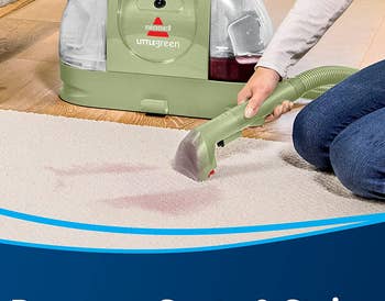 Model using a small green suction from a vacuum on a carpet 