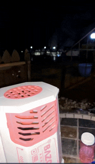 gif of a reviewer using the bubble gun showing lots of bubbles come out of it