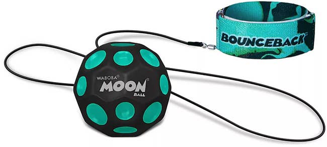 Bouncy toy ball with green spots and wrist strap, suitable for play and exercise