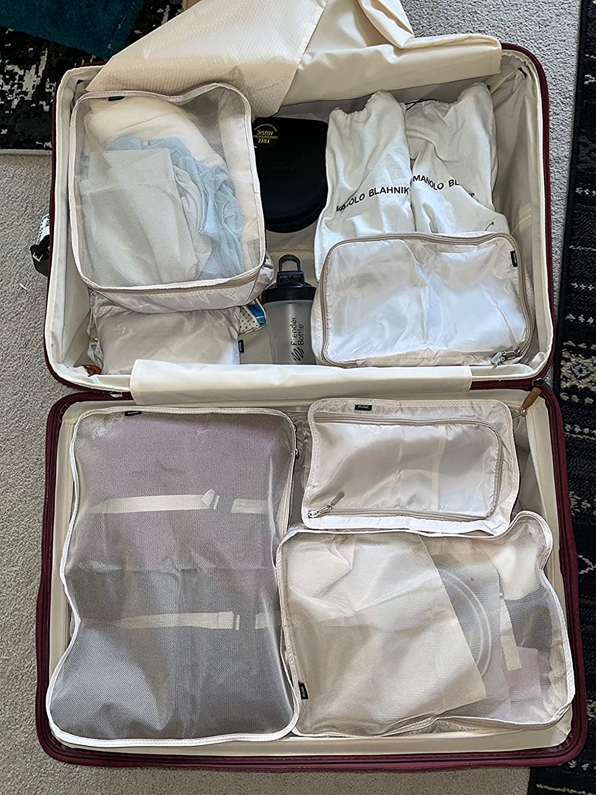 the set of packing cubes in a suitcase