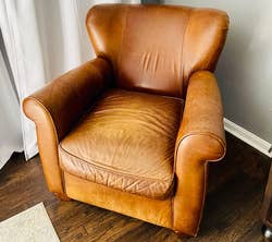 reviewer photo of a worn leather chair